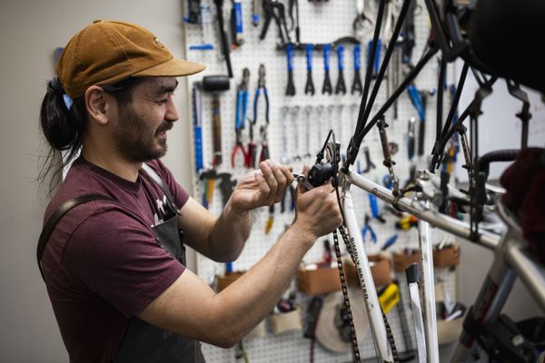 Modern bicycle repair workshop with professional tools and service stands
