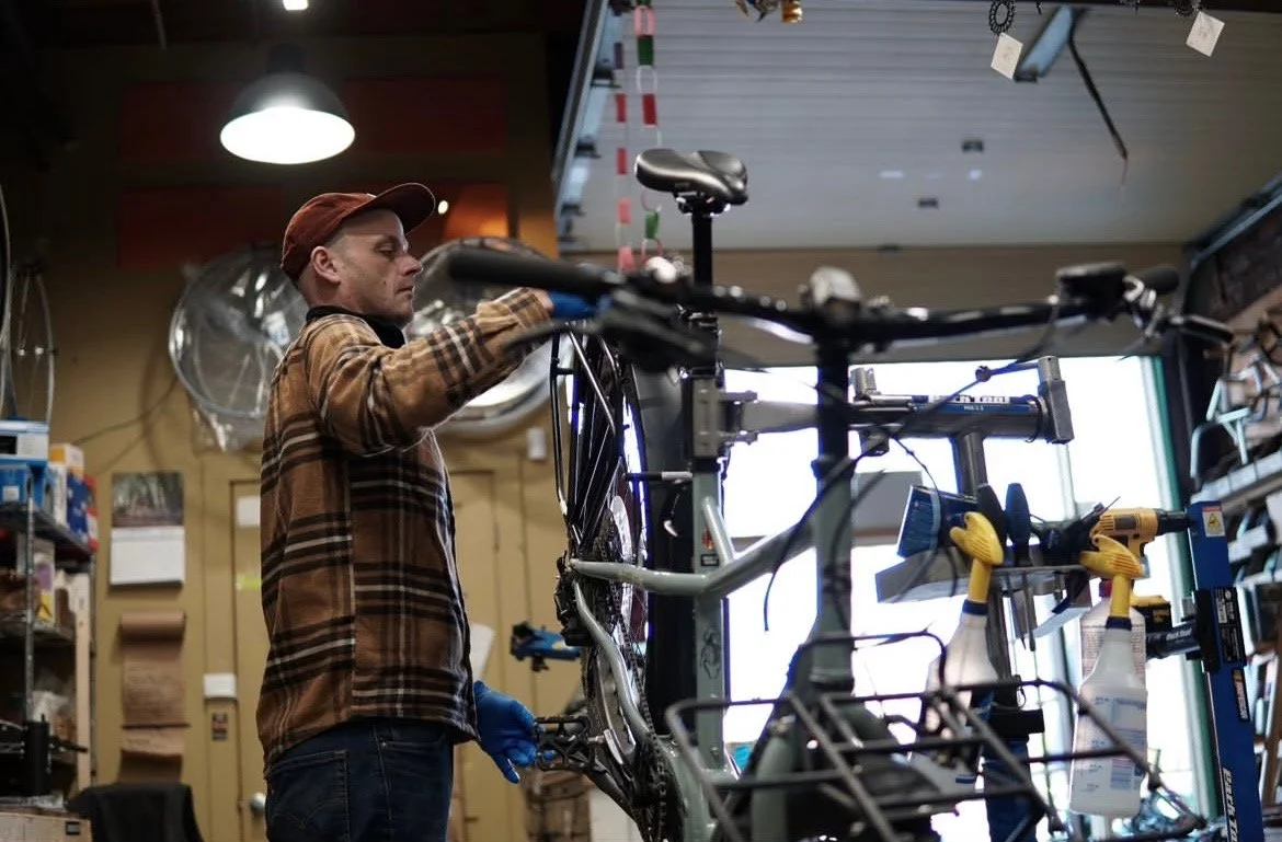 Illustrated bicycle receiving detailed mechanical repair